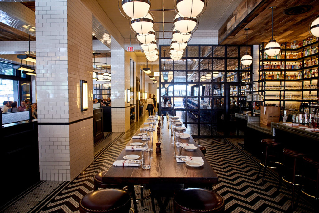 beautiful interior of the Smith - U Street with gorgeous tiling on the walls and floor plus an exquisite bar 