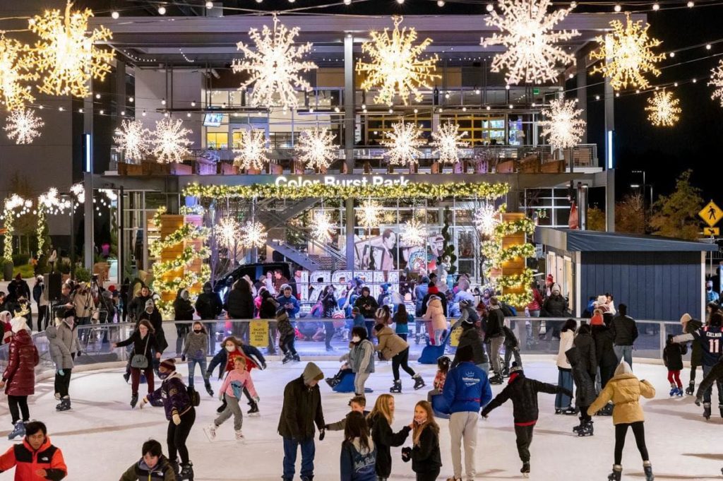 patrons ice skating under the lights at Color Burst Park Ice Arena