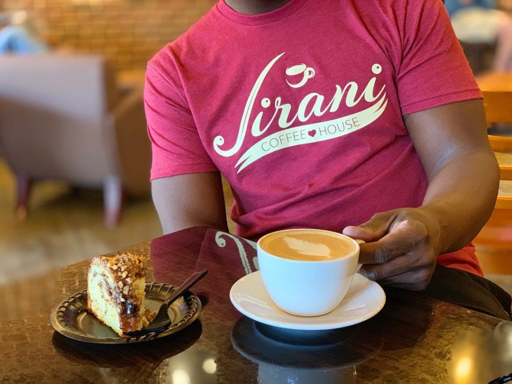 latte paired with cake at Jirani Coffeehouse
