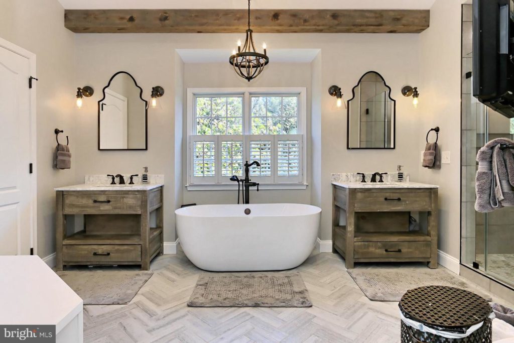 straight-on shot of luxury soaking tub and vanities