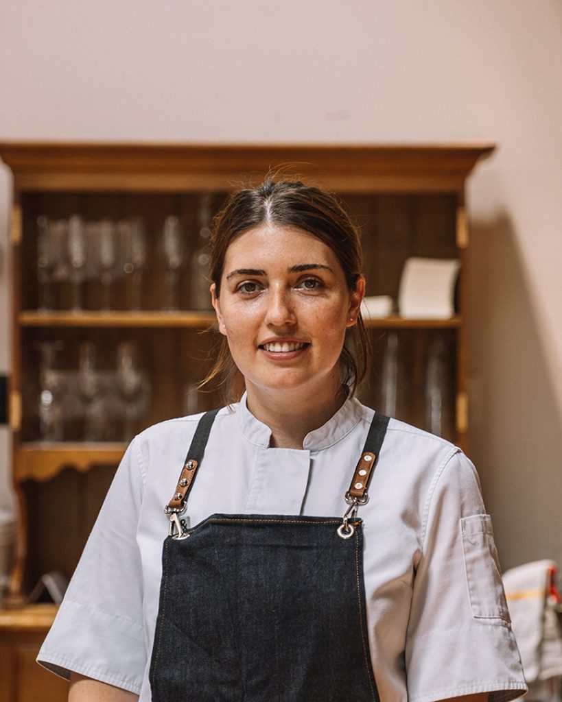 executive chef at Sospreso, a DC woman-owned restaurant, pictured smiling at the camera